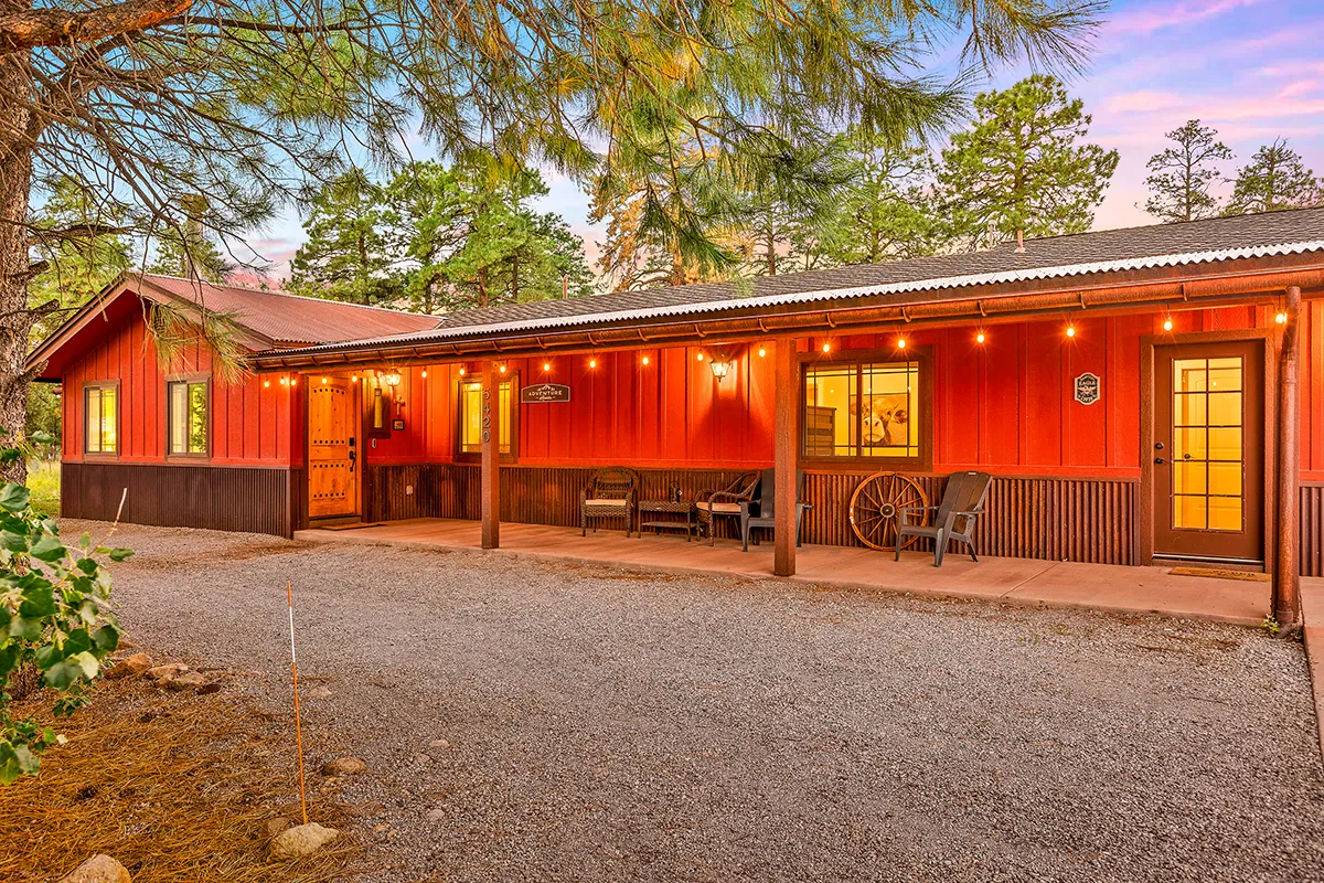 Beautiful Cabin Style Home nestled in 3 acres of Flagstaff Pinion Pines in the twilight